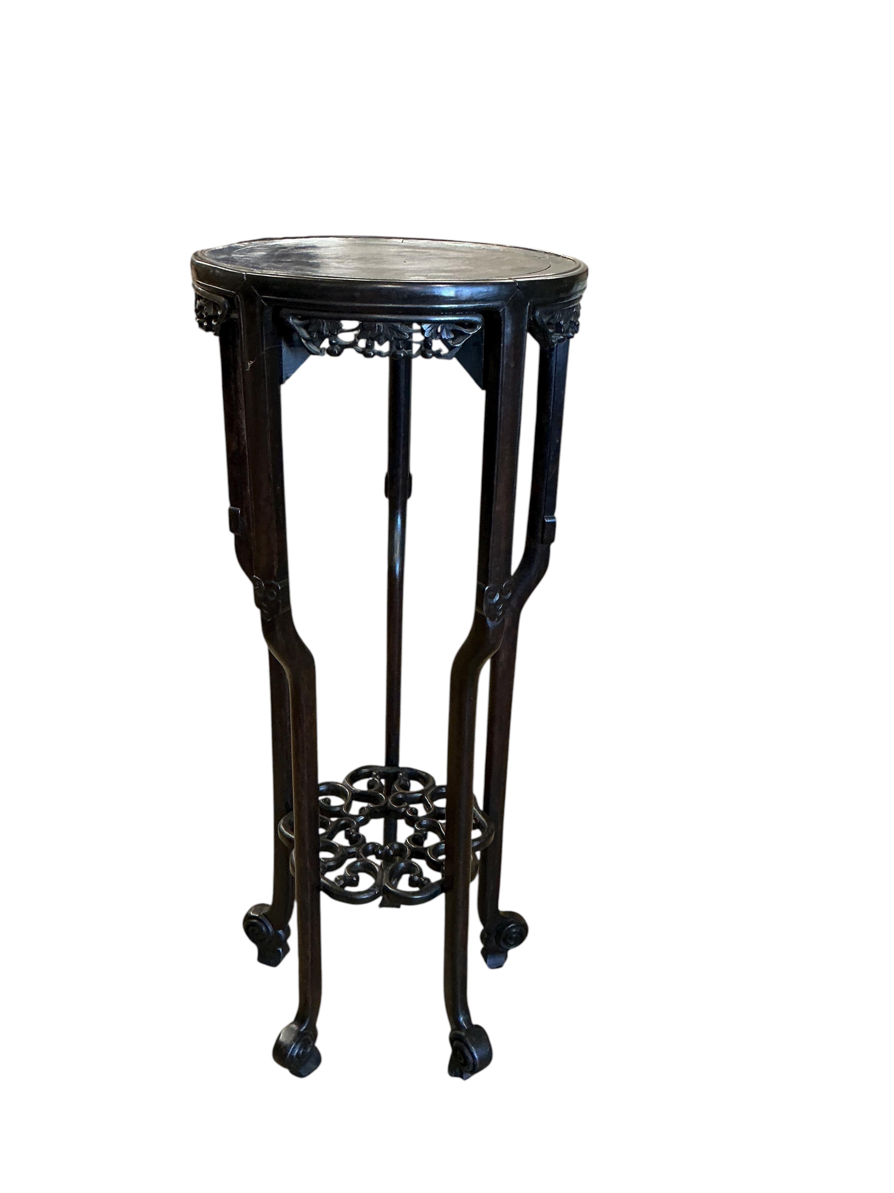 A Chinese carved hardwood vase stand, diameter 39cm, height 98cm